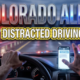 A viral, hyper-realistic YouTube thumbnail with a high-alert law enforcement atmosphere. The background is a blurred Colorado highway at dusk with emergency lights creating red and blue lens flares across the scene with dramatic cinematic lighting. The composition uses a low angle to focus on the main subject: a detailed steering wheel with one hand holding it while the other hand is suspended mid-air reaching toward a glowing smartphone on the dashboard, creating tension. Image size should be 3:2. The image features massive 3D typography with strict hierarchy: The Primary Text reads exactly: 'COLORADO ALERT'. This text is massive, the largest element in the frame, rendered in Police Badge Chrome with emergency light reflections to look like a high-budget 3D render. The Secondary Text reads exactly: 'DISTRACTED DRIVING'. This text is significantly smaller, positioned below the main text. It features a thick, distinct bright yellow border/outline (sticker style) with hazard stripe texture to contrast against the background. Make sure text 2 is always different theme, style, effect and border compared to text 1. The text materials correspond to the story's concept. Crucial Instruction: There is absolutely NO other text, numbers, watermarks, or subtitles in this image other than these two specific lines. 8k, Unreal Engine 5, cinematic render.