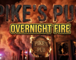 A viral, hyper-realistic YouTube thumbnail with a dramatic emergency atmosphere. The background is a nighttime commercial building exterior with billowing smoke clouds illuminated by red and orange emergency lights, creating an intense amber glow against the dark sky. The composition uses a low angle shot to focus on the main subject: a weathered wooden pub sign with flames licking at its edges, emergency vehicle lights reflecting off broken windows in the background. Image size should be 3:2. The image features massive 3D typography with strict hierarchy: The Primary Text reads exactly: 'PIKE'S PUB'. This text is massive, the largest element in the frame, rendered in charred wood texture with glowing ember edges to look like a high-budget 3D render. The Secondary Text reads exactly: 'OVERNIGHT FIRE'. This text is significantly smaller, positioned below the main text. It features a thick, distinct yellow and black border outline in bold sans-serif style to contrast against the smoky background. Make sure text 2 is always different theme, style, effect and border compared to text 1. The text materials correspond to the story's concept. Crucial Instruction: There is absolutely NO other text, numbers, watermarks, or subtitles in this image other than these two specific lines. 8k, Unreal Engine 5, cinematic render.