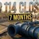 A viral, hyper-realistic YouTube thumbnail with an industrial infrastructure atmosphere. The background is a busy Indiana highway construction zone at golden hour with orange traffic cones lining both sides, heavy machinery visible in soft focus, and dramatic side lighting casting long shadows across asphalt. The composition uses a low angle shot to focus on the main subject: a massive blue water main pipe section resting on the roadside with visible valve connections and industrial bolts, surrounded by construction barriers and warning signs. Image size should be 3:2. The image features massive 3D typography with strict hierarchy: The Primary Text reads exactly: 'SR 114 CLOSED'. This text is massive, the largest element in the frame, rendered in reflective chrome metal with orange safety stripe accents to look like a high-budget 3D render with dramatic lighting reflections. The Secondary Text reads exactly: '7 MONTHS'. This text is significantly smaller, positioned below the main text. It features a thick, distinct bright yellow border with black outline in sticker style to contrast against the background. Make sure text 2 is always different theme, style, effect and border compared to text 1. The text materials correspond to the story's concept. Crucial Instruction: There is absolutely NO other text, numbers, watermarks, or subtitles in this image other than these two specific lines. 8k, Unreal Engine 5, cinematic render