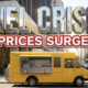 A viral, hyper-realistic YouTube thumbnail with a Gold and Marble Business atmosphere. The background is a busy city street corner with bright afternoon sunlight Lighting. The composition uses a Low Angle to focus on the main subject: a Detailed Faceless bright yellow mobile food truck. Image size should be 3:2. The image features massive 3D typography with strict hierarchy: The Primary Text reads exactly: 'FUEL CRISIS'. This text is massive, the largest element in the frame, rendered in glossy Chrome material to look like a high-budget 3D render. The Secondary Text reads exactly: 'PRICES SURGE'. This text is significantly smaller, positioned below or next to the main text. It features a thick, distinct red color border and outline sticker style to contrast against the background. Make sure text 2 is always different theme, style, effect and border compared to text 1. The text materials correspond to the story's concept. Crucial Instruction: There is absolutely NO other text, numbers, watermarks, or subtitles in this image other than these two specific lines. 8k, Unreal Engine 5, cinematic render.