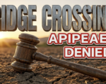 A viral, hyper-realistic YouTube thumbnail with a Earthy/Sunset atmosphere. The background is a detailed rustic Colorado farming field at dusk with warm golden hour lighting. The composition uses a Macro focus to focus on the main subject: a detailed rustic wooden judge gavel resting on dry farming soil. Image size should be 3:2. The image features massive 3D typography with strict hierarchy: The Primary Text reads exactly: 'RIDGE CROSSING'. This text is massive, the largest element in the frame, rendered in weathered brushed steel to look like a high-budget 3D render. The Secondary Text reads exactly: 'APPEAL DENIED'. This text is significantly smaller, positioned below or next to the main text. It features a thick, distinct crimson red border/outline (sticker style) to contrast against the background. Make sure text 2 is always different theme, style, effect and border compared to text 1. The text materials correspond to the story's concept. Crucial Instruction: There is absolutely NO other text, numbers, watermarks, or subtitles in this image other than these two specific lines. 8k, Unreal Engine 5, cinematic render