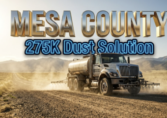A viral, hyper-realistic YouTube thumbnail with a professional municipal infrastructure atmosphere. The background is a dusty Colorado dirt road stretching toward distant mountains with golden afternoon sunlight and swirling dust particles suspended in the air. The composition uses a low-angle camera perspective to focus on the main subject: a large metal road treatment tanker truck with magnesium chloride spraying equipment visible. The image features massive 3D typography with strict hierarchy: The Primary Text reads exactly: "MESA COUNTY". This text is massive, the largest element in the frame, rendered in shimmering chrome and metallic gold material to look like a high-budget 3D render with real-time reflections. The Secondary Text reads exactly: "275K Dust Solution". This text is significantly smaller, positioned below the primary text, featuring a thick bright blue neon border with a sticker-style outline that contrasts sharply against the dusty background. The text materials correspond to the professional infrastructure concept. Crucial Instruction: There is absolutely no other text, numbers, watermarks, or subtitles in this image other than these two specific lines. 8k, Unreal Engine 5, cinematic render.