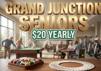 A viral, hyper-realistic YouTube thumbnail with a warm, community-focused lifestyle atmosphere. The background is a welcoming recreation center interior with soft natural lighting streaming through large windows, featuring pool tables, card tables, and exercise equipment in soft focus. The composition uses a medium-wide angle to showcase the inviting space with a prominent billiard ball rack and playing cards arranged artistically in the foreground as the main subject. Image size should be 3:2. The image features massive 3D typography with strict hierarchy: The Primary Text reads exactly: 'GRAND JUNCTION SENIORS'. This text is massive, the largest element in the frame, rendered in warm golden chrome with subtle embossed texture to look like a high-budget 3D render with soft glow effects. The Secondary Text reads exactly: '$20 YEARLY'. This text is significantly smaller, positioned below the main text. It features a thick, distinct emerald green border with white fill (sticker style) to contrast against the background. Make sure text 2 is always different theme, style, effect and border compared to text 1. The text materials correspond to the story's concept of affordable community wellness. Crucial Instruction: There is absolutely NO other text, numbers, watermarks, or subtitles in this image other than these two specific lines. 8k, Unreal Engine 5, cinematic render