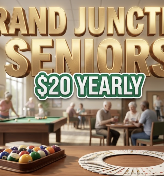 A viral, hyper-realistic YouTube thumbnail with a warm, community-focused lifestyle atmosphere. The background is a welcoming recreation center interior with soft natural lighting streaming through large windows, featuring pool tables, card tables, and exercise equipment in soft focus. The composition uses a medium-wide angle to showcase the inviting space with a prominent billiard ball rack and playing cards arranged artistically in the foreground as the main subject. Image size should be 3:2. The image features massive 3D typography with strict hierarchy: The Primary Text reads exactly: 'GRAND JUNCTION SENIORS'. This text is massive, the largest element in the frame, rendered in warm golden chrome with subtle embossed texture to look like a high-budget 3D render with soft glow effects. The Secondary Text reads exactly: '$20 YEARLY'. This text is significantly smaller, positioned below the main text. It features a thick, distinct emerald green border with white fill (sticker style) to contrast against the background. Make sure text 2 is always different theme, style, effect and border compared to text 1. The text materials correspond to the story's concept of affordable community wellness. Crucial Instruction: There is absolutely NO other text, numbers, watermarks, or subtitles in this image other than these two specific lines. 8k, Unreal Engine 5, cinematic render