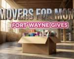 A viral, hyper-realistic YouTube thumbnail with a Lifestyle atmosphere. The background is a clean, modern warehouse interior with warm, sun-drenched lighting coming through large windows. The composition uses a Low Angle for power to focus on the main subject: a large, sturdy cardboard moving box overflowing with colorful gift-wrapped packages and high-end toiletries. Image size should be 3:2. The image features massive 3D typography with strict hierarchy: The Primary Text reads exactly: 'MOVERS FOR MOMS'. This text is massive, the largest element in the frame, rendered in Chrome to look like a high-budget 3D render. The Secondary Text reads exactly: 'FORT WAYNE GIVES'. This text is significantly smaller, positioned below the main text. It features a thick, bright pink sticker style border to contrast against the background. Make sure text 2 is a different theme and effect compared to text 1. The text materials correspond to the story's concept. Crucial Instruction: There is absolutely NO other text, numbers, watermarks, or subtitles in this image other than these two specific lines. 8k, Unreal Engine 5, cinematic render
