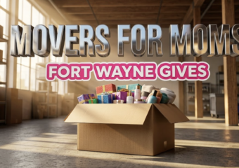 A viral, hyper-realistic YouTube thumbnail with a Lifestyle atmosphere. The background is a clean, modern warehouse interior with warm, sun-drenched lighting coming through large windows. The composition uses a Low Angle for power to focus on the main subject: a large, sturdy cardboard moving box overflowing with colorful gift-wrapped packages and high-end toiletries. Image size should be 3:2. The image features massive 3D typography with strict hierarchy: The Primary Text reads exactly: 'MOVERS FOR MOMS'. This text is massive, the largest element in the frame, rendered in Chrome to look like a high-budget 3D render. The Secondary Text reads exactly: 'FORT WAYNE GIVES'. This text is significantly smaller, positioned below the main text. It features a thick, bright pink sticker style border to contrast against the background. Make sure text 2 is a different theme and effect compared to text 1. The text materials correspond to the story's concept. Crucial Instruction: There is absolutely NO other text, numbers, watermarks, or subtitles in this image other than these two specific lines. 8k, Unreal Engine 5, cinematic render