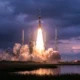 Amazon Leo satellite launch on a ULA Atlas 5 rocket from Cape Canaveral at dusk.