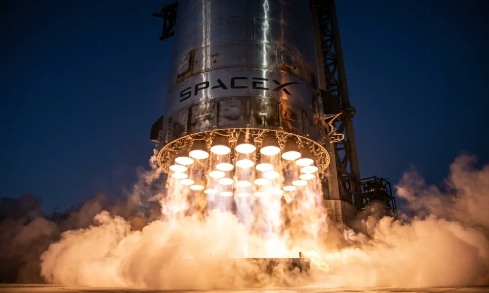 SpaceX Super Heavy booster engines glow during Starship Flight 12 ascent from Starbase.