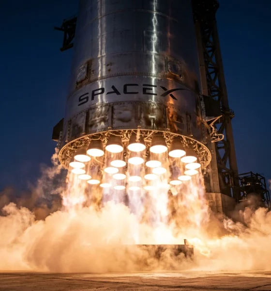 SpaceX Super Heavy booster engines glow during Starship Flight 12 ascent from Starbase.