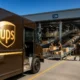 UPS brown delivery truck after Amazon volume exit earnings