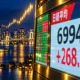 Nikkei 225 tags 70000 closes 69947